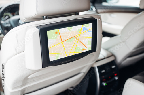 Modern car multimedia control system with navigation map mode at the headrest of the seat 