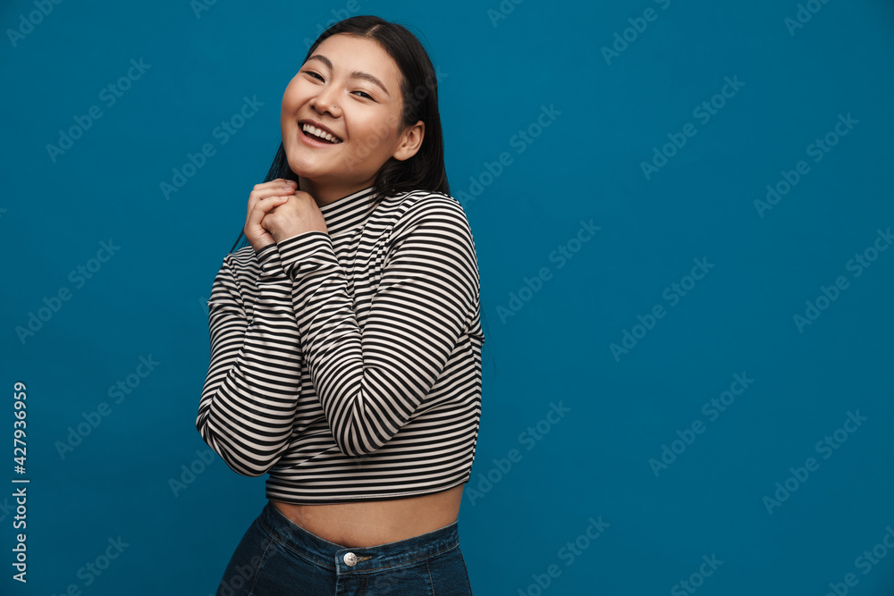 Brunette asian teen girl smiling and looking at camera Brunette asian teen girl smiling and looking at camera