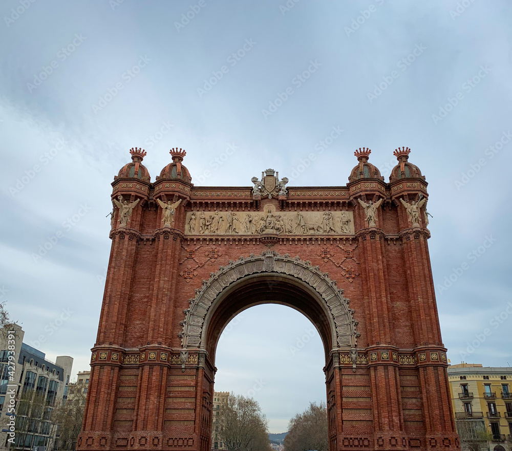 Front view of the famous red Arc de Triomf in Barcelona, Spain.