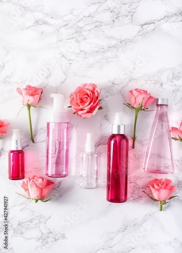 bottles skincare lotion serum medical rose flowers. organic natural cosmetic