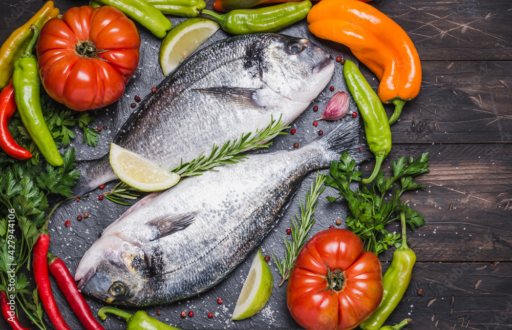 Fish with vegetables cooking background, dorado fish copy space. Fish with vegetables cooking background, dorado fish copy space.