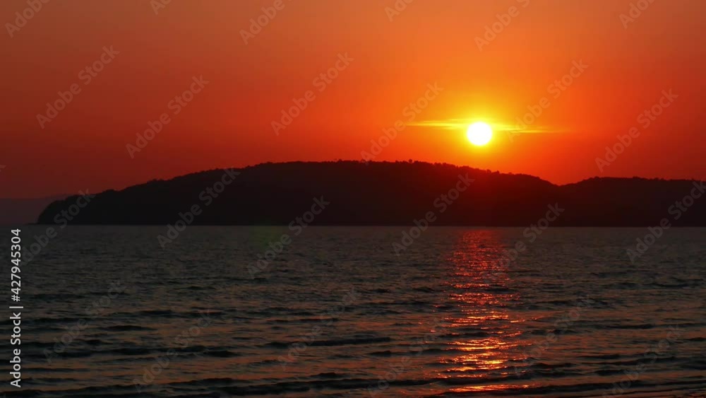 A beautiful light sunset on the beach, sunset, mountain and sky, Nature background. Beautiful scene. Sunlight reflect on water surface, Krabi Thailand. Beautiful stunning view of the Andaman sea. A beautiful light sunset on the beach, sunset, mountain and sky, Nature background. Beautiful scene. Sunlight reflect on water surface, Krabi Thailand. Beautiful stunning view of the Andaman sea.