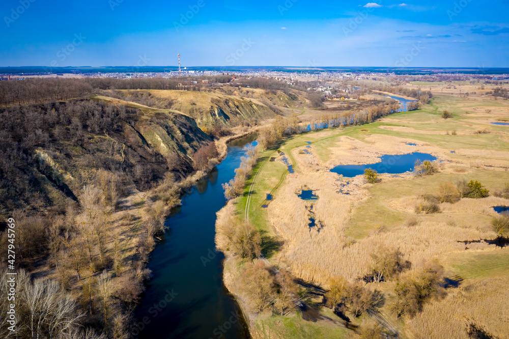 aerial view to spring valley with Siverskyi Donets river near Zmiiv city
