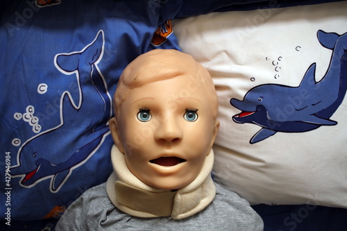 a medical child's mannequin in a Shants collar