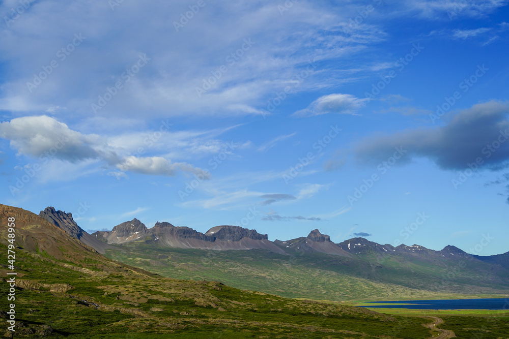 A vast natural landscape with mountains, rivers and the sky