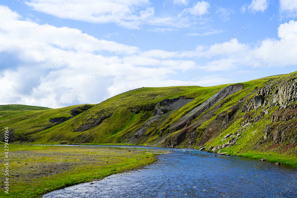 A landscape of rivers with clean water, a refreshing blue sky and clouds