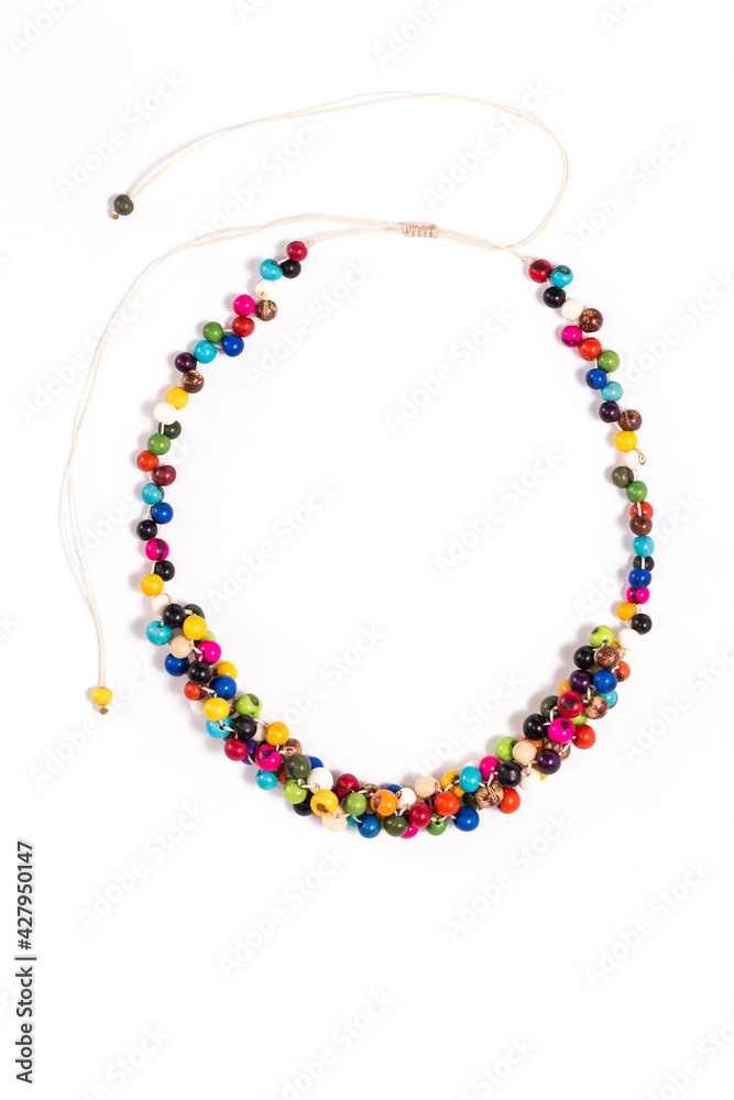 Vertical closeup of stylish upcycled colorful necklace made out of post-consumer waste, isolated on a white background. Creative reuse of waste, ideal gift for her. - obrazy, fototapety, plakaty 