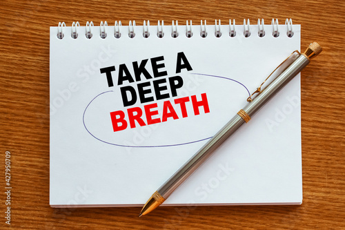 Wallpaper Mural Notepad with inscriptions TAKE A DEEP BREATH on a white background. business concept. Torontodigital.ca