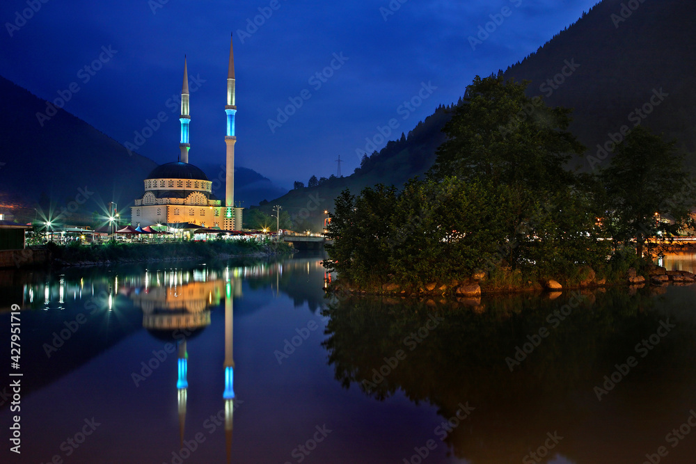 A mosque reflected in Uzun lake (Uzungol), Trabzon Province, Black Sea region, Turkey.