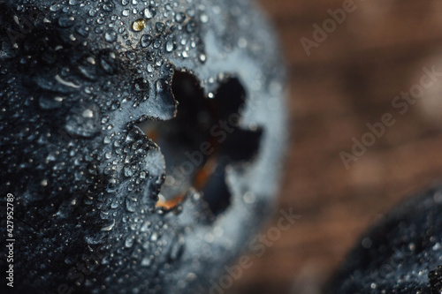 Blueberries with water drops. Beautiful macro photo of a berry. Berry background. Health and freshness concept.