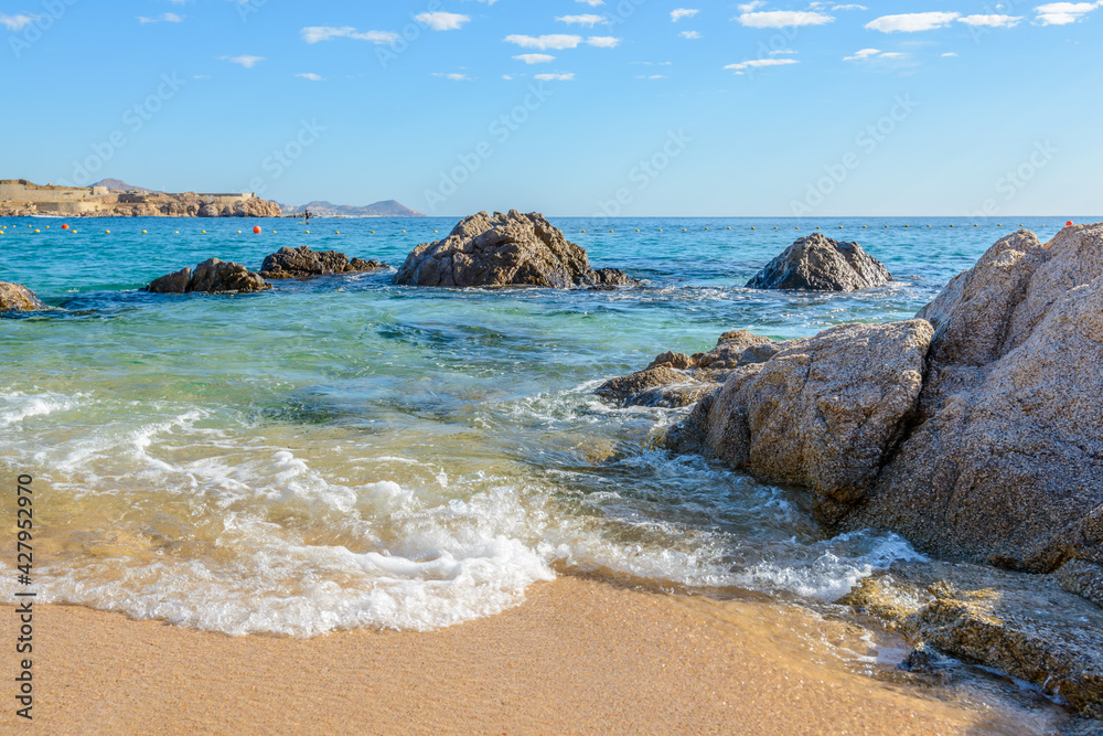 Playa el Chileno Beach, Cabo San Lucas, Mexico. Different stages of the fantastic ocean waves. Rocky and sandy beach. Playa el Chileno Beach, Cabo San Lucas, Mexico. Different stages of the fantastic ocean waves. Rocky and sandy beach.