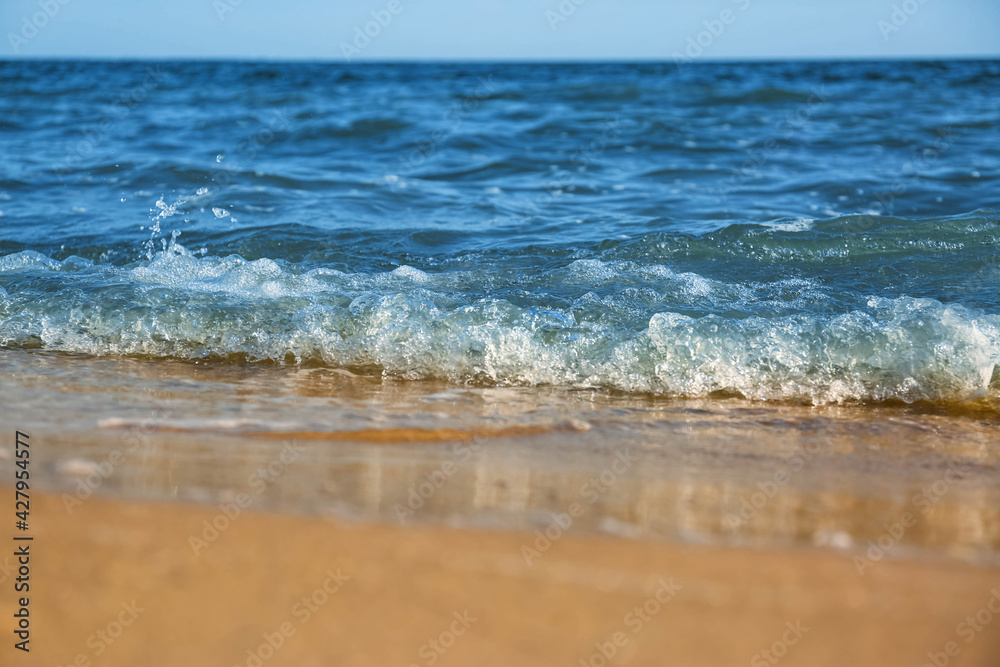 Beautiful view of sea waves on beach, closeup Beautiful view of sea waves on beach, closeup
