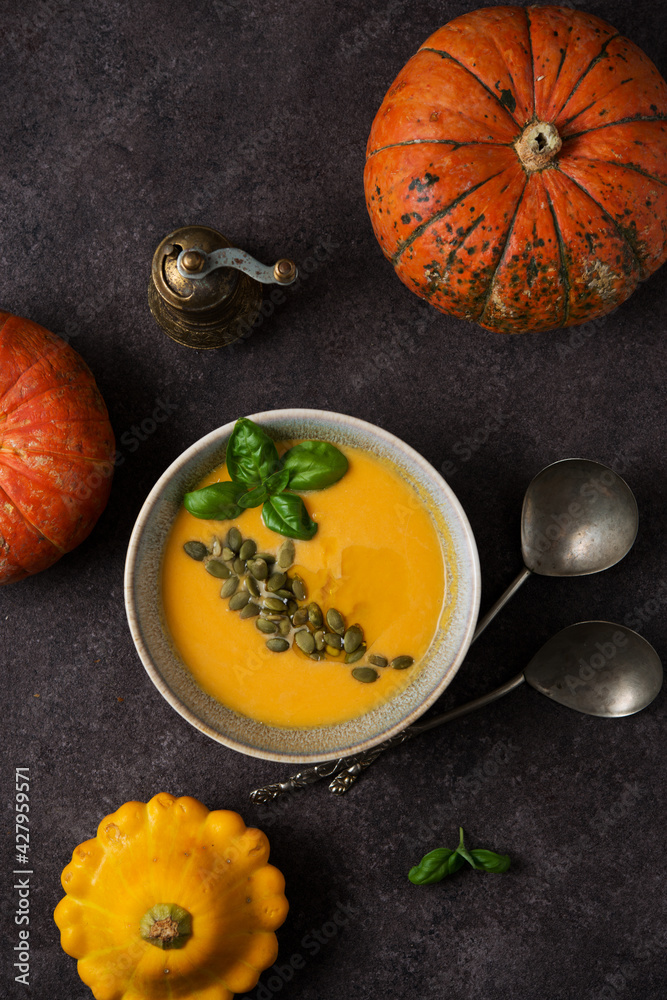 Hot autumn pumpkin soup with pumpkin seeds, top view Hot autumn pumpkin soup with pumpkin seeds, top view