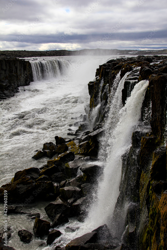 Selfoss waterfall crashing down basaltic rocks near Dettifoss, Iceland Selfoss waterfall crashing down basaltic rocks near Dettifoss, Iceland