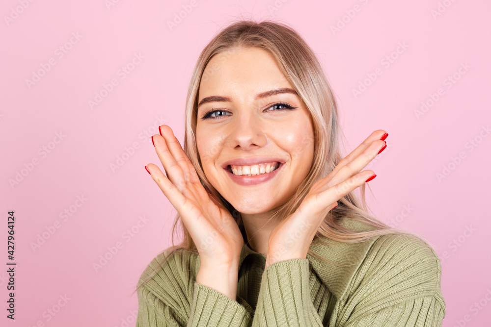 Pretty european woman in casual sweater on pink background happy look to camera shocked amazed surprised open mouth Pretty european woman in casual sweater on pink background happy look to camera shocked amazed surprised open mouth