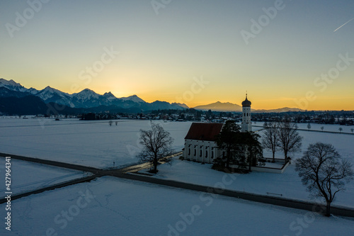 aerial view from St. Coloman church in Bavaria mountains at sunset, Germany © Rick Neves