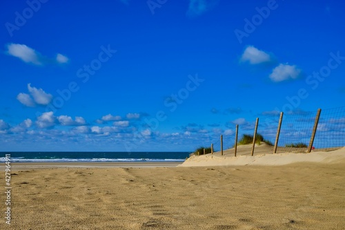 Fence in the beach close to the sea © Alfonso