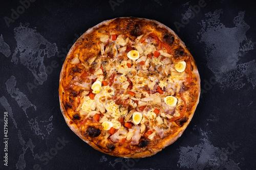 Top view of delicious and crispy pizza. American or Italian pizza. Cooking background concept.