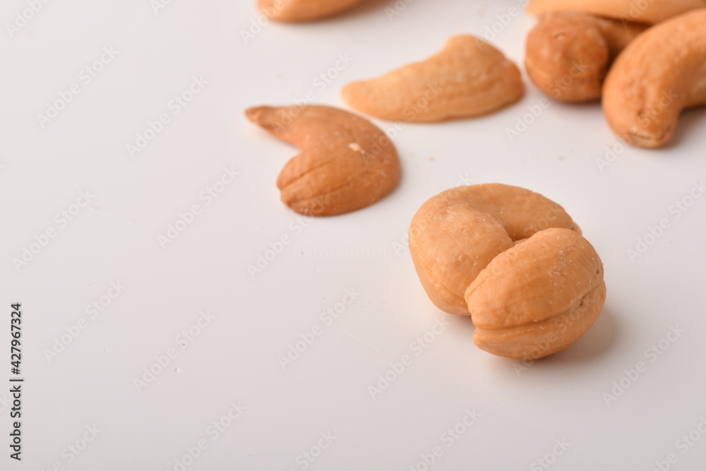 Heap of cashew nuts isolated on white background. Heap of cashew nuts isolated on white background.