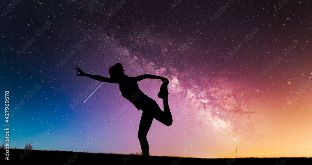 woman doing yoga under night sky with stars spirituality