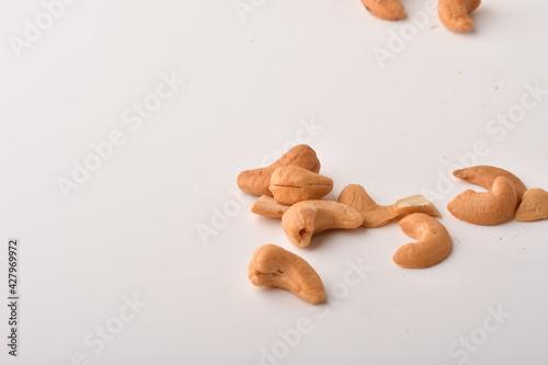 Heap of cashew nuts isolated on white background.