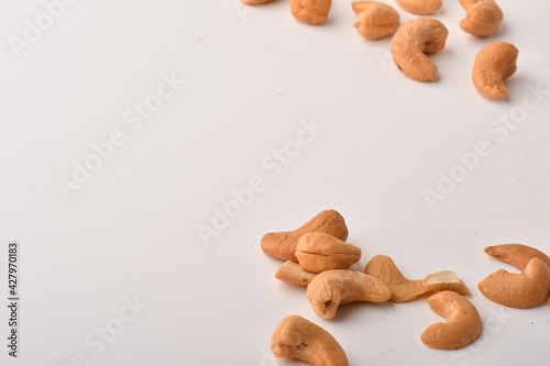 Heap of cashew nuts isolated on white background.