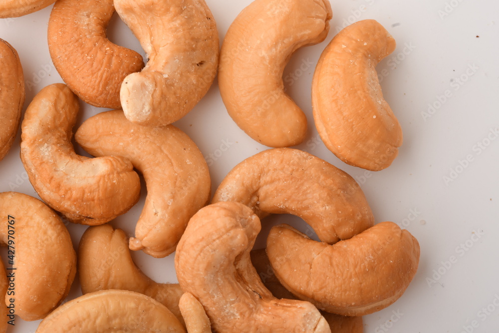 Heap of cashew nuts isolated on white background. Heap of cashew nuts isolated on white background.