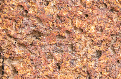 blur of red laterite brick wall Porous and fine-grained Background pattern