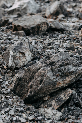 Mining process. Rocks for mining. Big gray limestone.