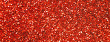 glittering background of red sequins closeup. Sparkle festive texture. banner