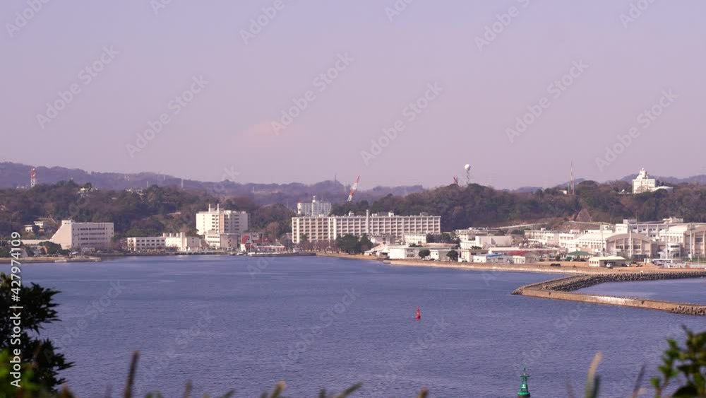 View out towards Japanese port town with ocean View out towards Japanese port town with ocean