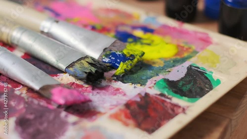 color paint art ,Row of artist paintbrushes closeup on artistic canvas.