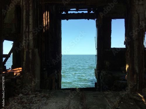 Abandoned factory shop in the middle of the sea  A clear example of how time and nature take their toll 