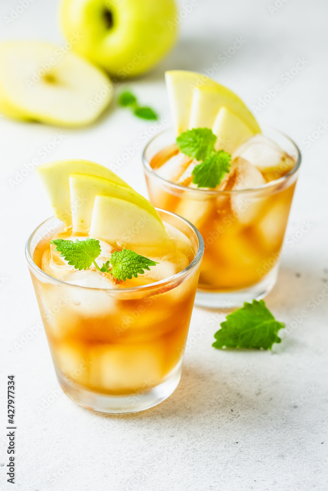 Kombucha cocktail, summer festive party drink, apple iced tea in glasses. Space for text. Kombucha cocktail, summer festive party drink, apple iced tea in glasses. Space for text.