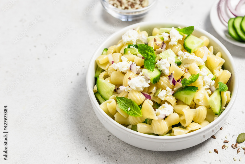 Spring fresh light vegan cucumber pasta salad. Space for text. Spring fresh light vegan cucumber pasta salad. Space for text.