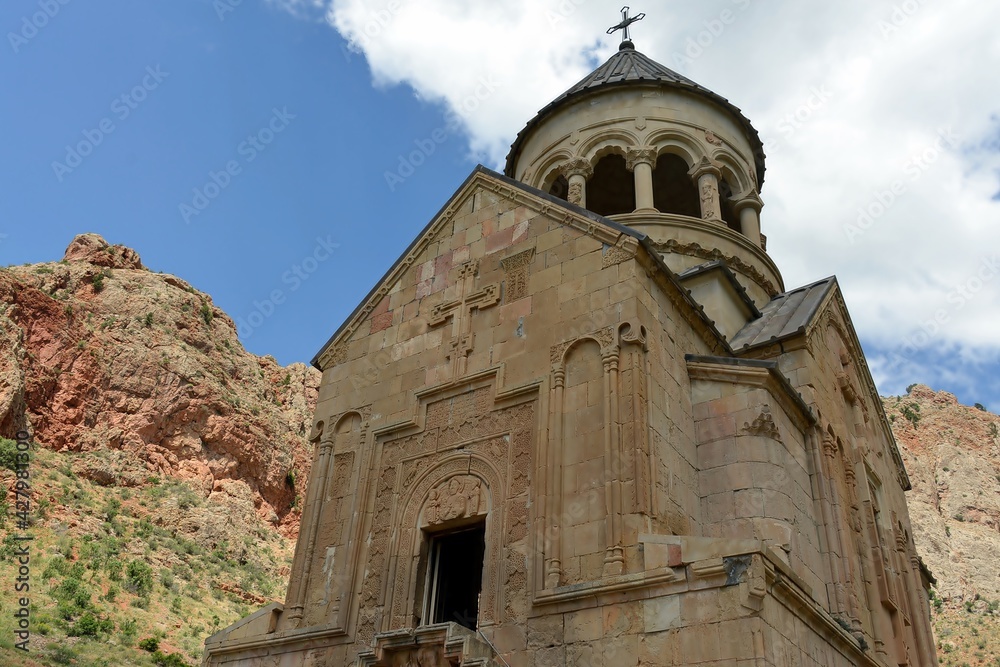 Noravank is a 13th-century monastery near the city of Yeghegnadzor, Armenia, located in a narrow gorge of the Amaghu River. The gorge is known for its height and for the steep brick red walls  