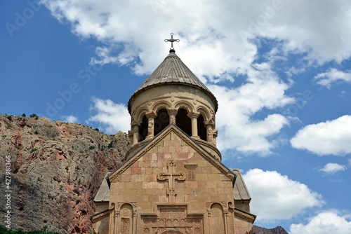 Noravank is a 13th-century monastery near the city of Yeghegnadzor, Armenia, located in a narrow gorge of the Amaghu River. The gorge is known for its height and for the steep brick red walls 