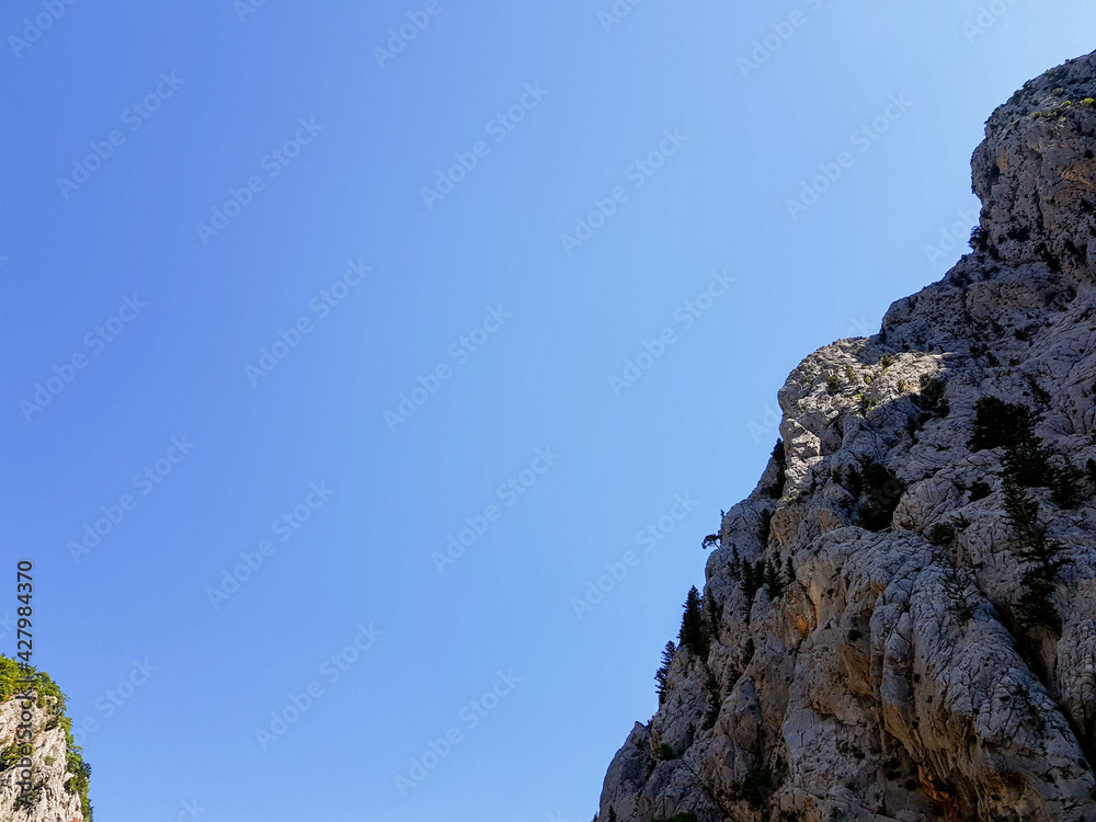 Seascape against the backdrop of mountains on a cloudless sunny day. Seascape against the backdrop of mountains on a cloudless sunny day.