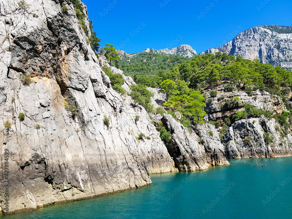Seascape against the backdrop of mountains on a cloudless sunny day. Seascape against the backdrop of mountains on a cloudless sunny day.