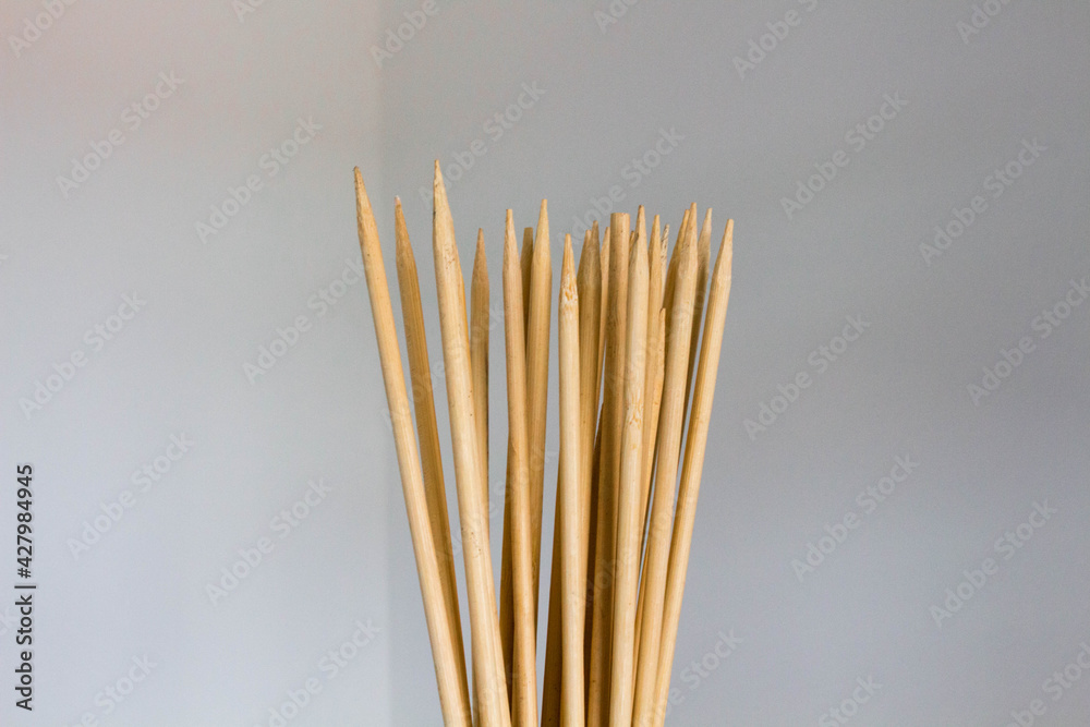 custom made wallpaper toronto digitalSharp wooden sticks on a white background.