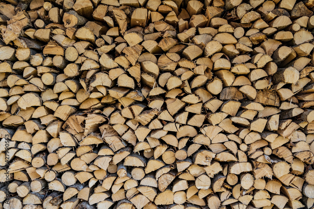 Wall made of stacked wood. Background Wall made of stacked wood. Background