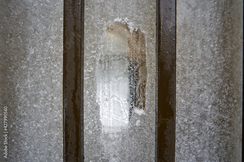 Glass, covered with a thin layer of ice. Some are taken off to see what's inside. 