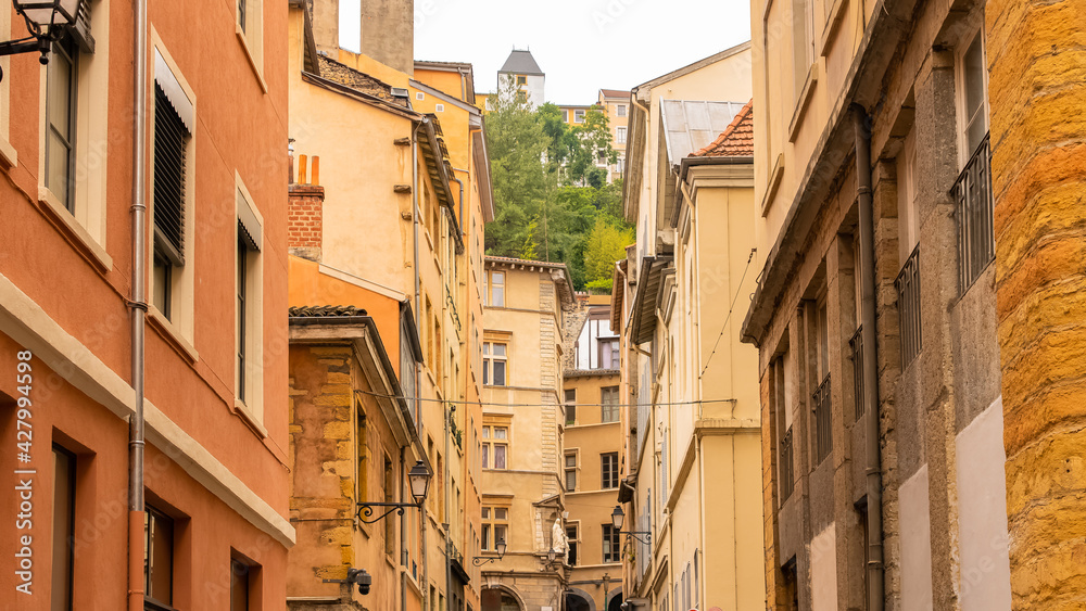 Lyon, typical street in the center, with colorful buildings
