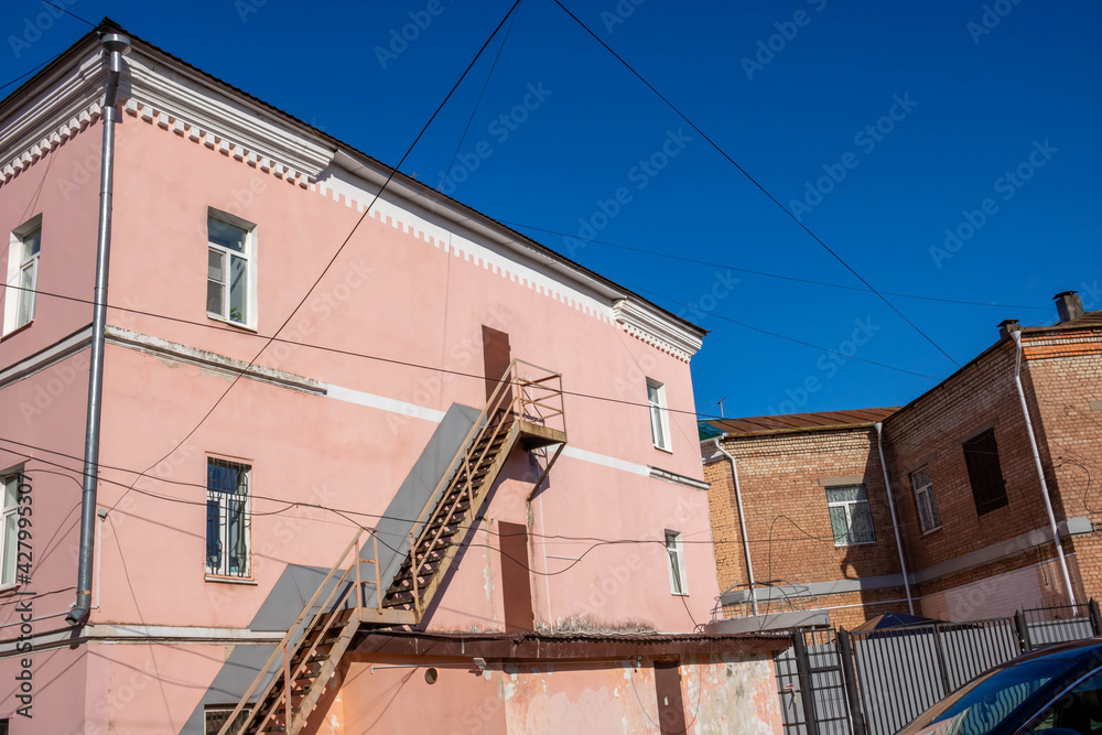 External staircase on the facade of the building. Fire escape in the open air. Emergency ladder