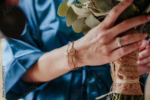 bride and groom holding hands wedding day ring bouquet with flowers in white wedding dress