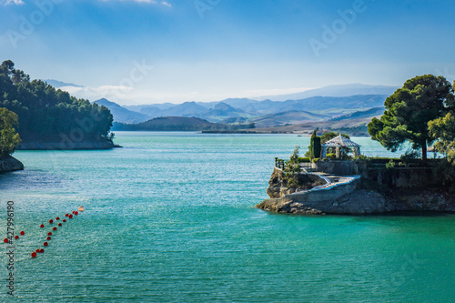 View on the turquoise water of the Guadalhorce and Guadalteba Reservoirs, two artificial lakes in the andalusian backcountry in Spain