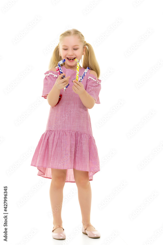 The girl is a sweet tooth, she is very happy about the candy.