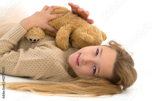 Little girl with teddy bear.The concept of a happy childhood, children emotions.