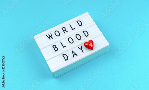 World blood donor day concept background with text and inscription, halthcare and helping photo