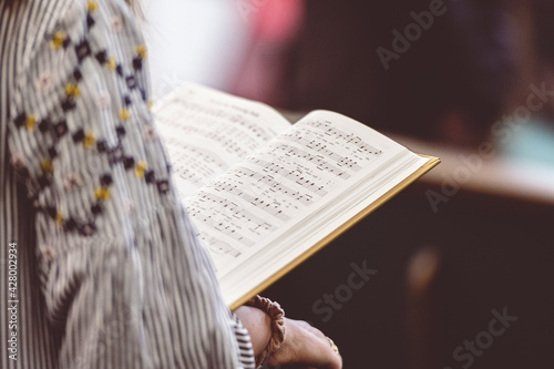 Canvas Print Female holding a book of sheet music